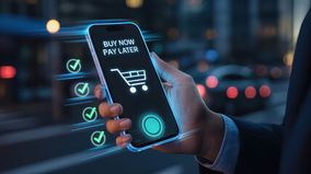 Buy Now Pay Later image of person holding mobile phone with shopping cart and button to select.